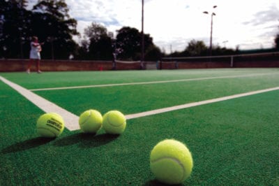 A tennis ball is on a tennis court